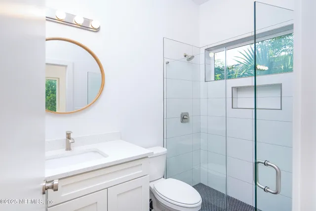 a kitchen with stainless steel appliances granite countertop a sink a refrigerator and a stove