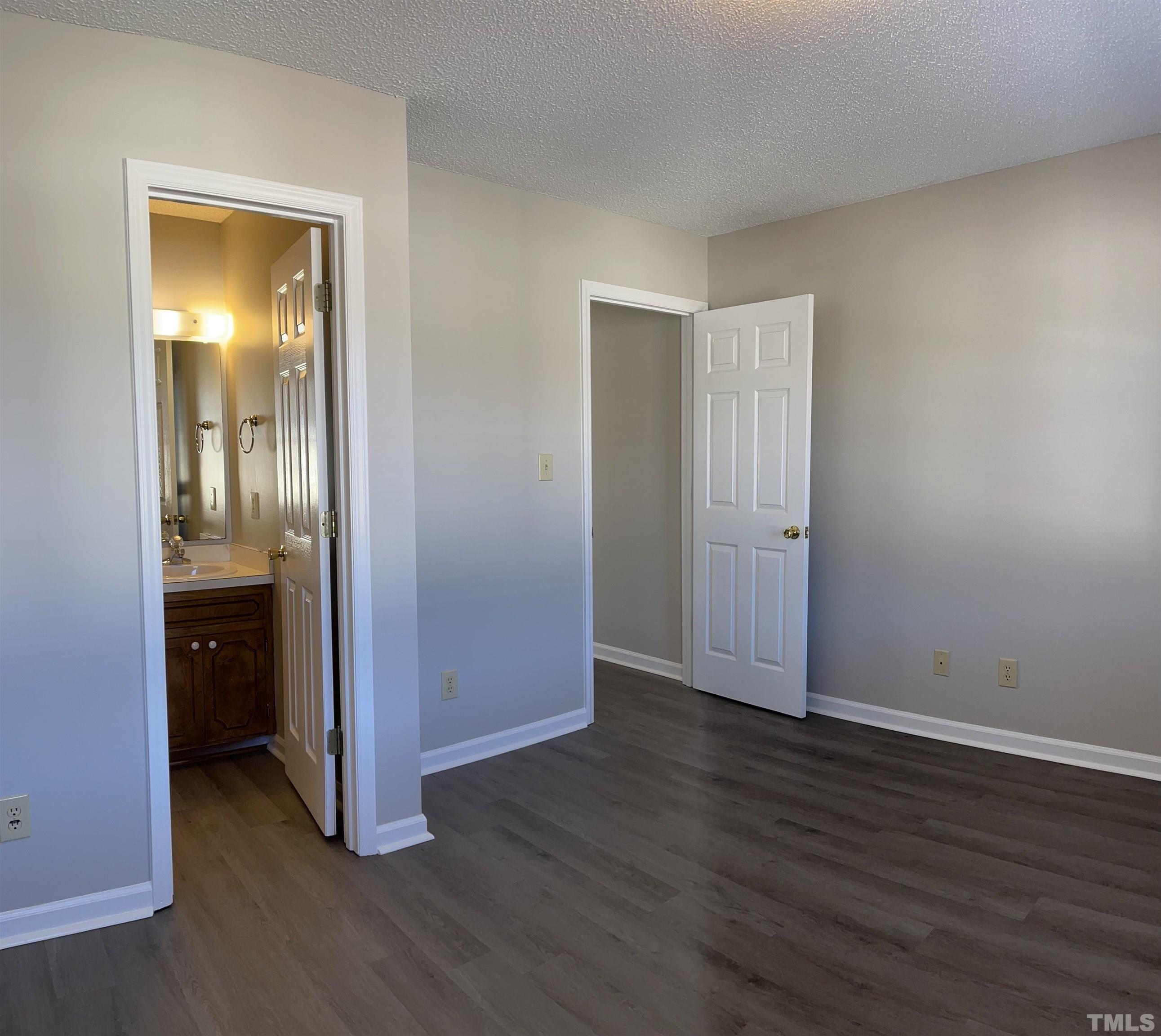 412 South Broad Street East, Unit 46 Angier, NC 27501 - Photo 11 of 16 an empty room with wooden floor and closet