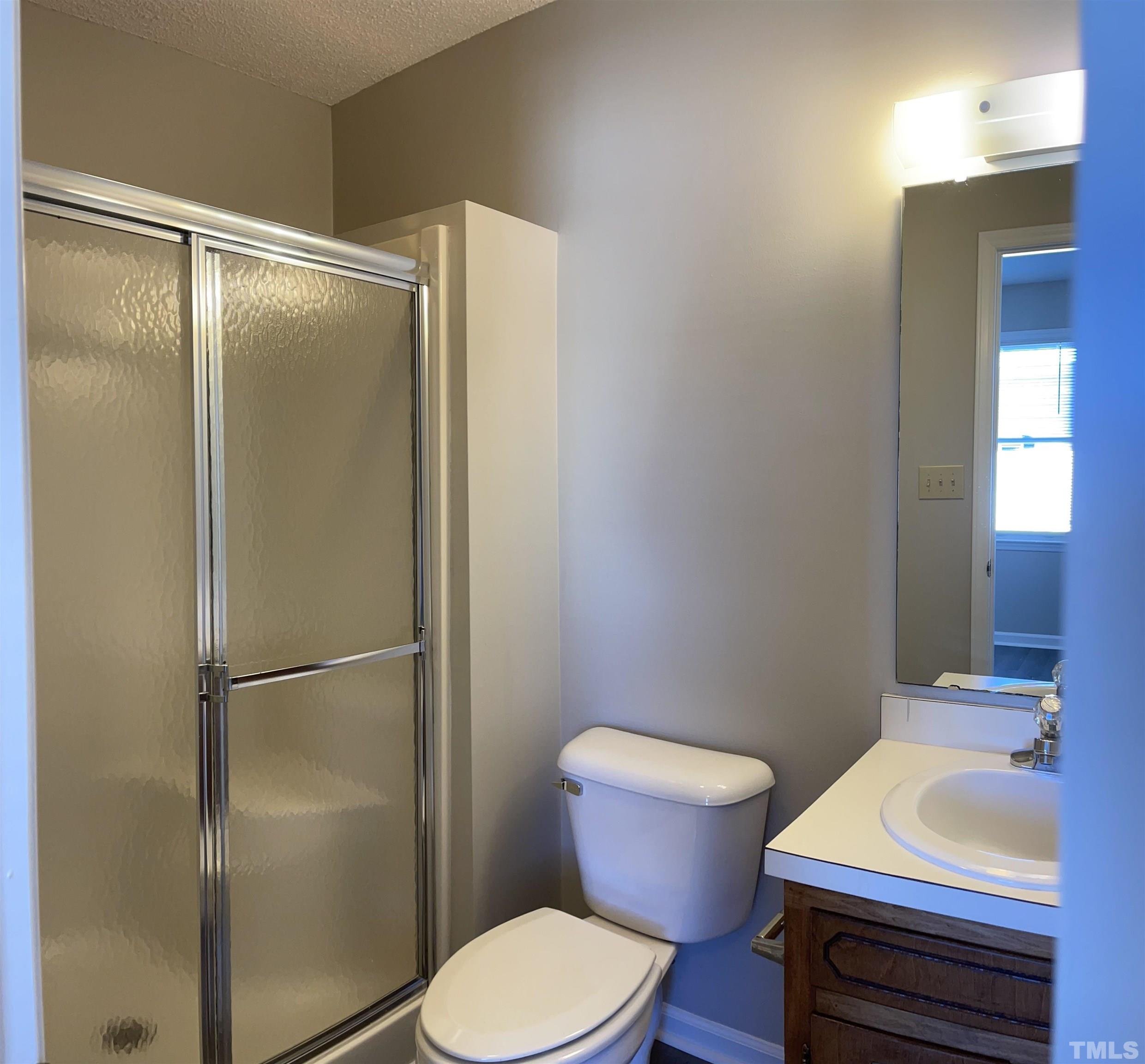 412 South Broad Street East, Unit 46 Angier, NC 27501 - Photo 12 of 16 a bathroom with a sink toilet and shower