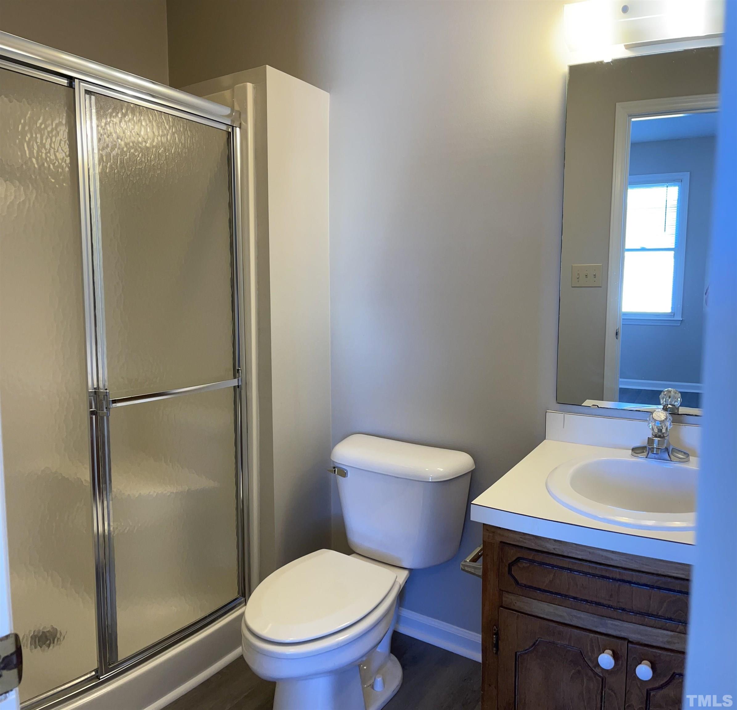 412 South Broad Street East, Unit 46 Angier, NC 27501 - Photo 13 of 16 a bathroom with a sink toilet and shower