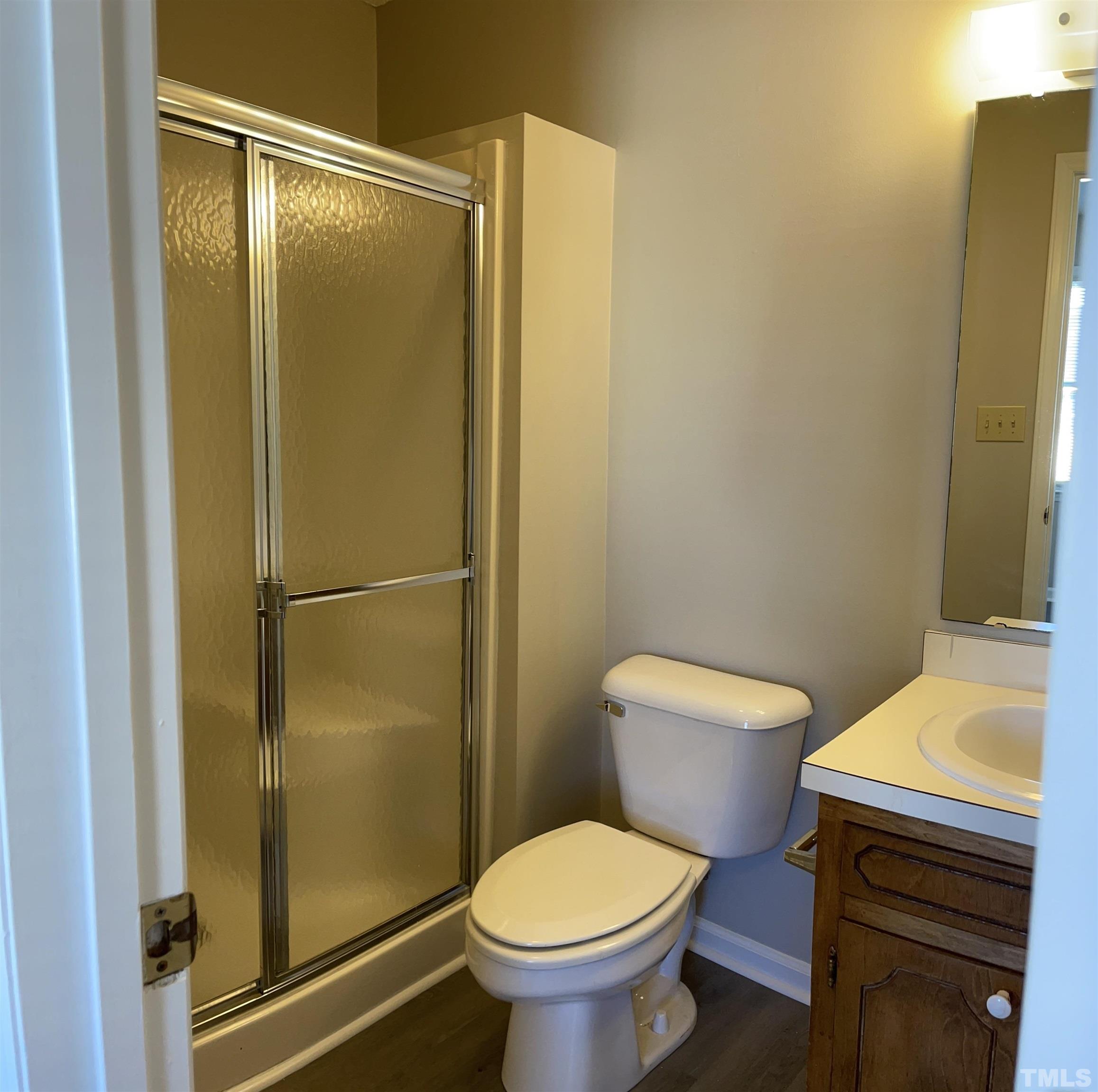 412 South Broad Street East, Unit 46 Angier, NC 27501 - Photo 14 of 16 a bathroom with a sink toilet and shower