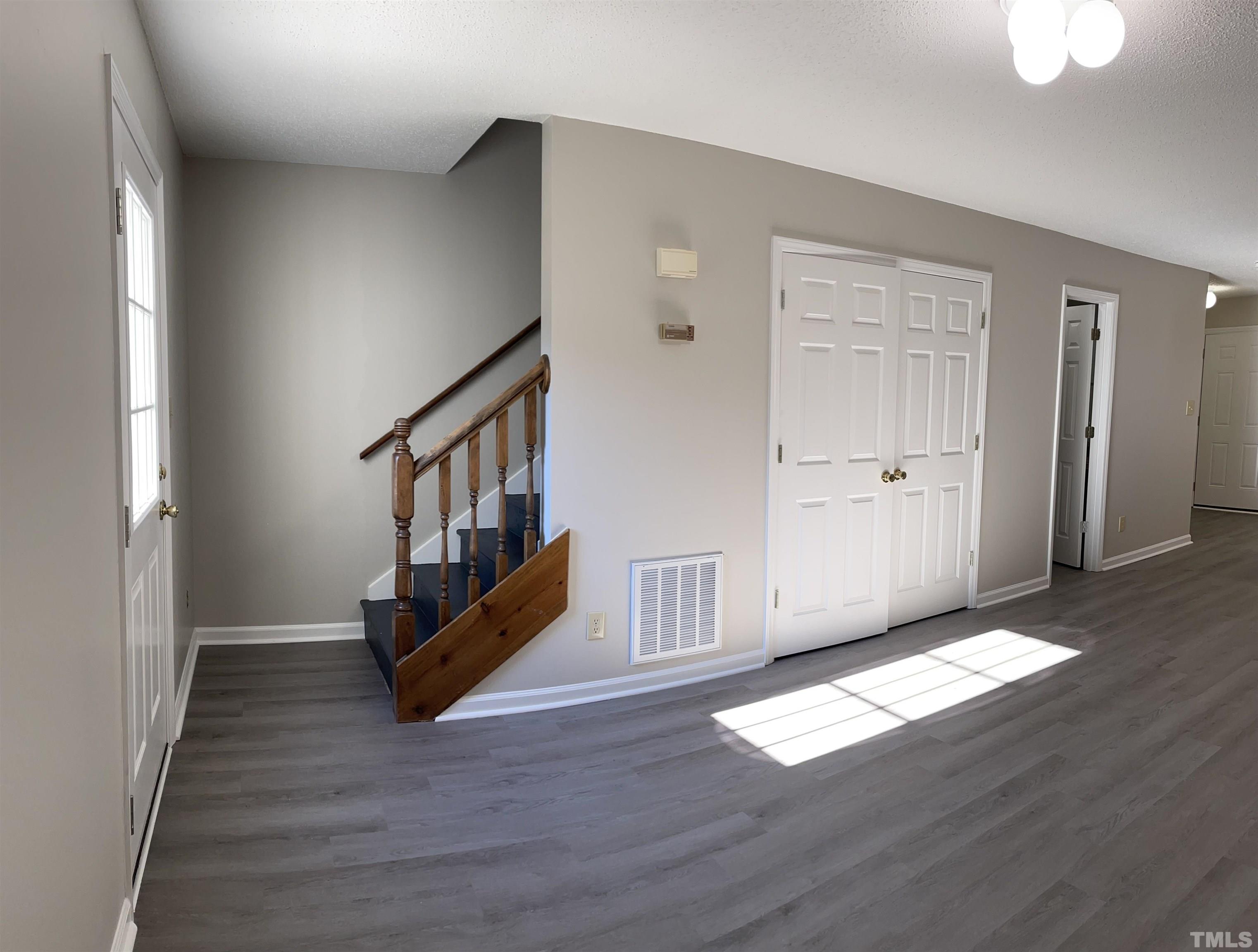 412 South Broad Street East, Unit 46 Angier, NC 27501 - Photo 4 of 16 a view of an empty room with wooden floor and a window