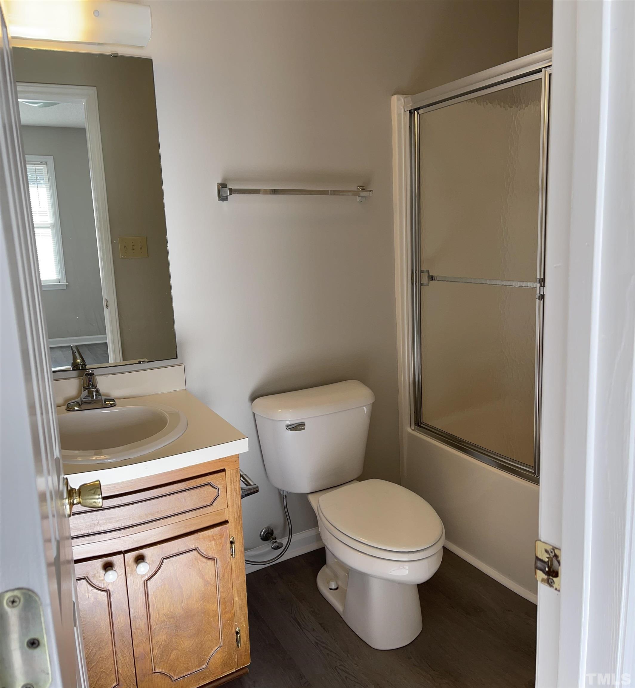 412 South Broad Street East, Unit 46 Angier, NC 27501 - Photo 5 of 16 a bathroom with a sink a toilet and shower