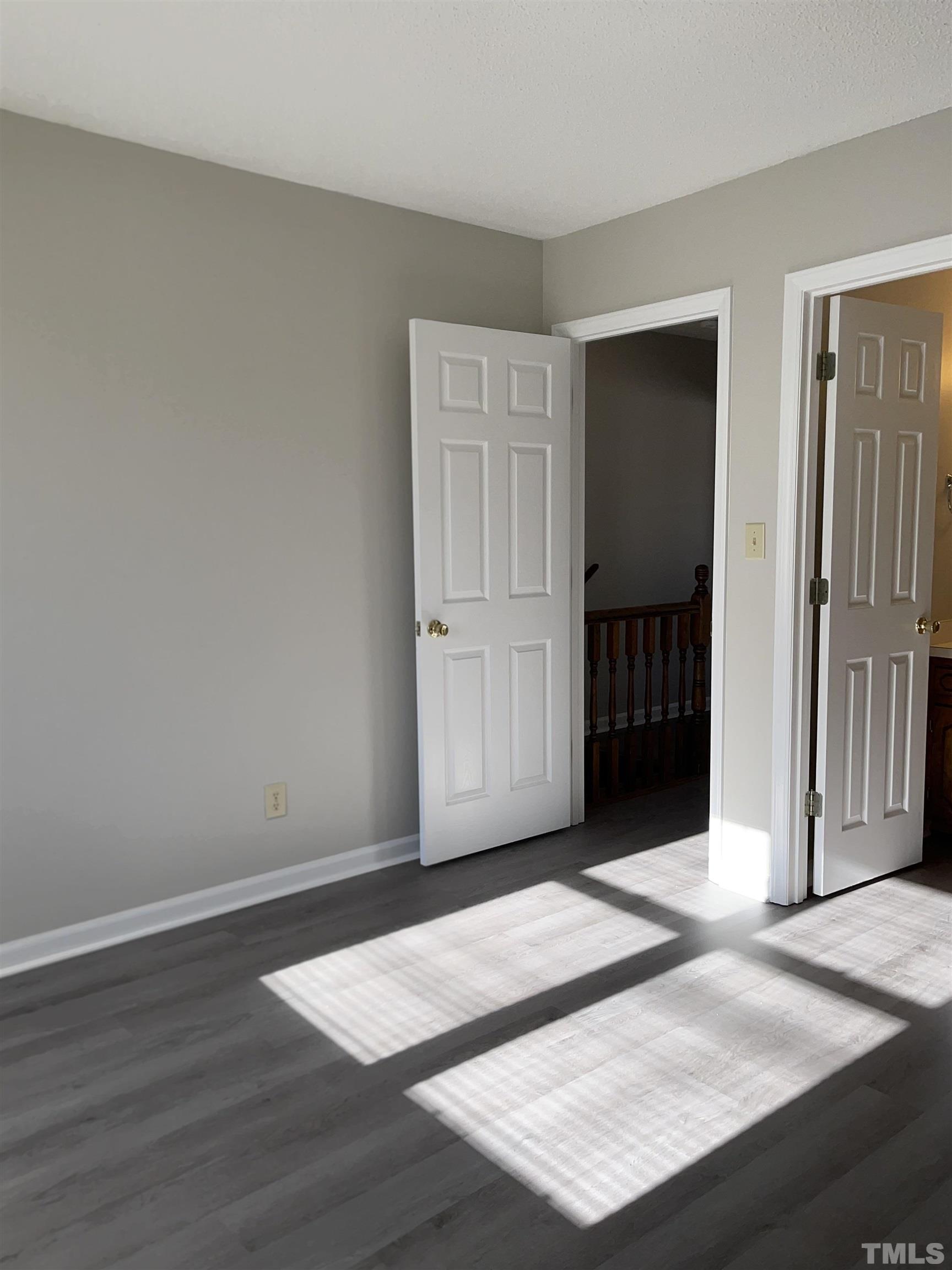 412 South Broad Street East, Unit 46 Angier, NC 27501 - Photo 8 of 16 an empty room with wooden floor and closet