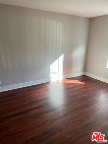 a view of front door with wooden floor