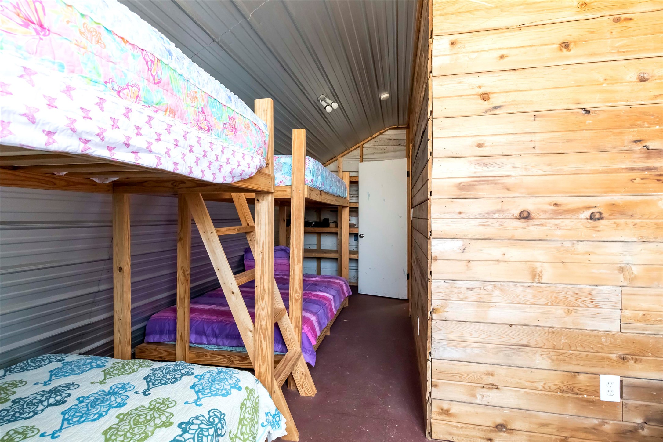 208 Old Potato Road Paige, TX 78659 - Photo 28 of 40 Bunkhouse dedroom with lofted ceiling, and wooden walls