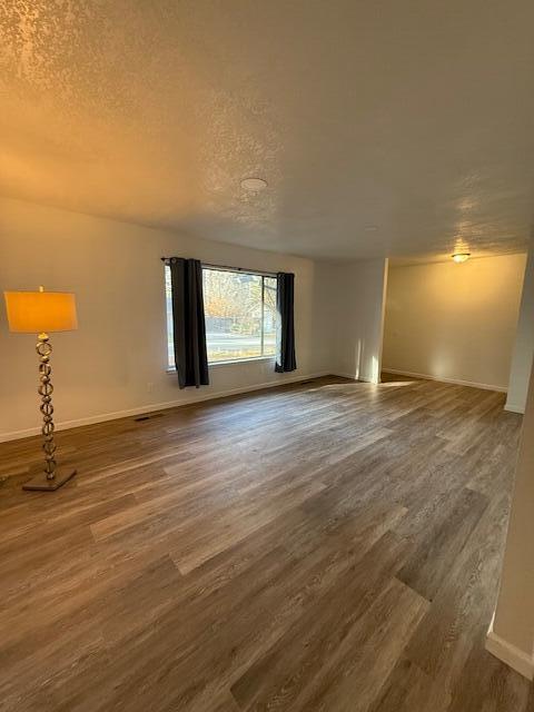 20612 Burney Court Burney, CA 96013 - Photo 17 of 40 a view of an empty room with window and wooden floor