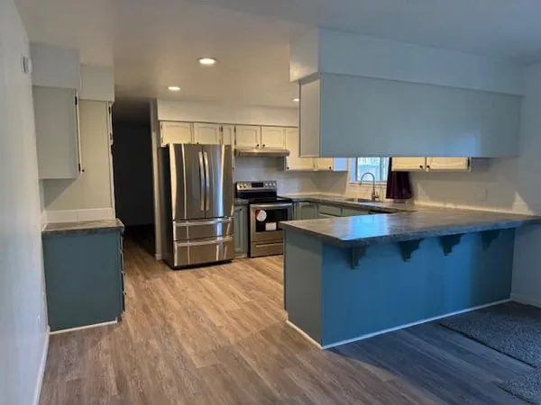 a bathroom with a tub and sink