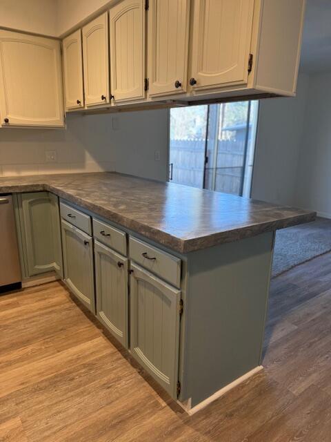 20612 Burney Court Burney, CA 96013 - Photo 9 of 40 a kitchen with stainless steel appliances granite countertop a refrigerator a stove top oven and a sink with wooden cabinets