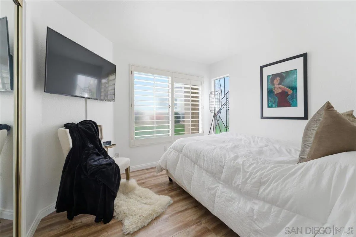29585 Circle R Greens Drive Escondido, CA 92026 - Photo 15 of 40 a bed room with a bed and a flat tv screen on dresser