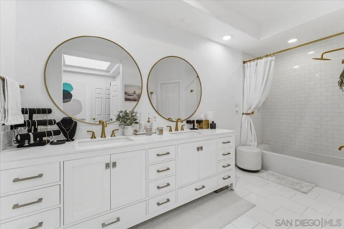 29585 Circle R Greens Drive Escondido, CA 92026 - Photo 18 of 40 a bathroom with a double vanity sink mirror and shower