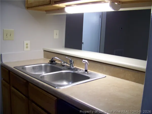 a bathroom with a sink and mirror