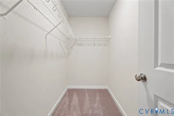 a view of small space with empty racks on the wall