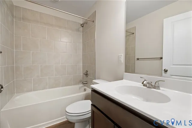 a bathroom with a sink a toilet and a bathtub