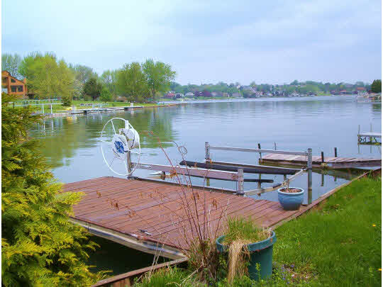 507 Baintree Road Lake Summerset, IL 61019 - Photo 8 of 11 a view of a lake with house in the background