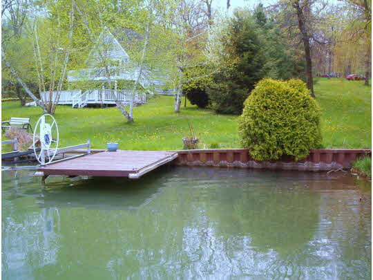 507 Baintree Road Lake Summerset, IL 61019 - Photo 10 of 11 a view of a lake with houses