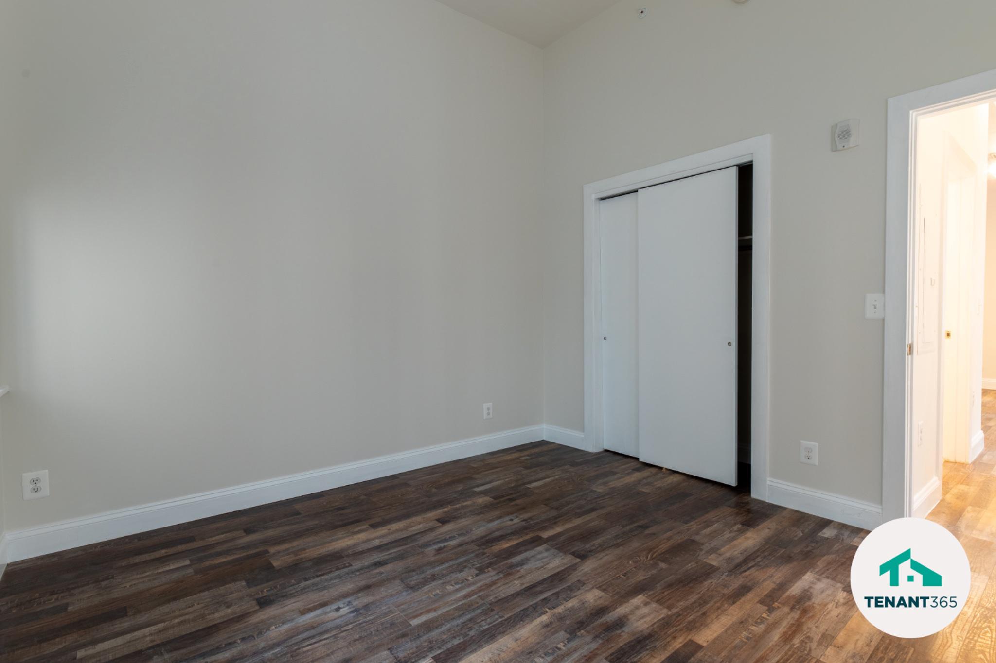 8 East Fayette Street, Unit 201 Baltimore, MD 21202 - Photo 7 of 14 Bright and spacious bedroom with new floors