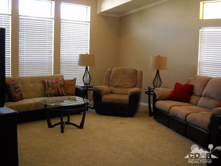 38881 Parker Ridge Way Palm Desert, CA 92260 - Photo 2 of 7 a living room with furniture and a window