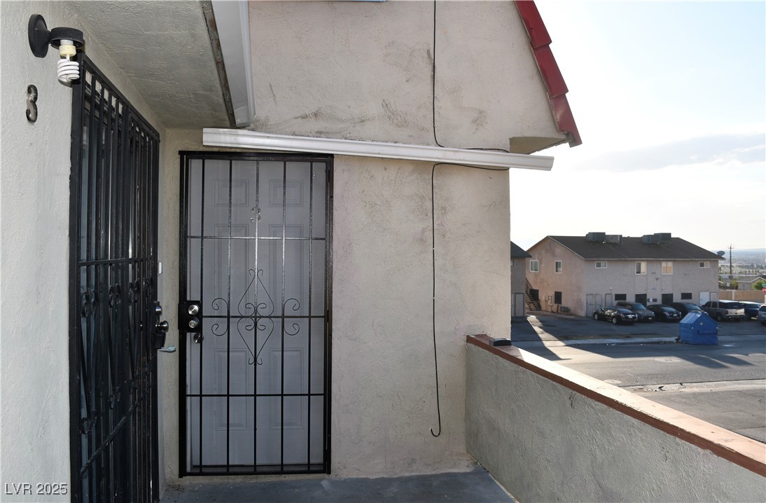 6925 Hopkins Drive, Unit 3 Las Vegas, NV 89156 - Photo 1 of 12 Entrance to property featuring stucco siding
