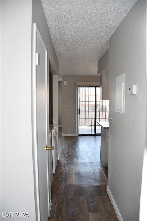 6925 Hopkins Drive, Unit 3 Las Vegas, NV 89156 - Photo 12 of 12 Hall with dark wood-style flooring, a textured ceiling, and a textured wall