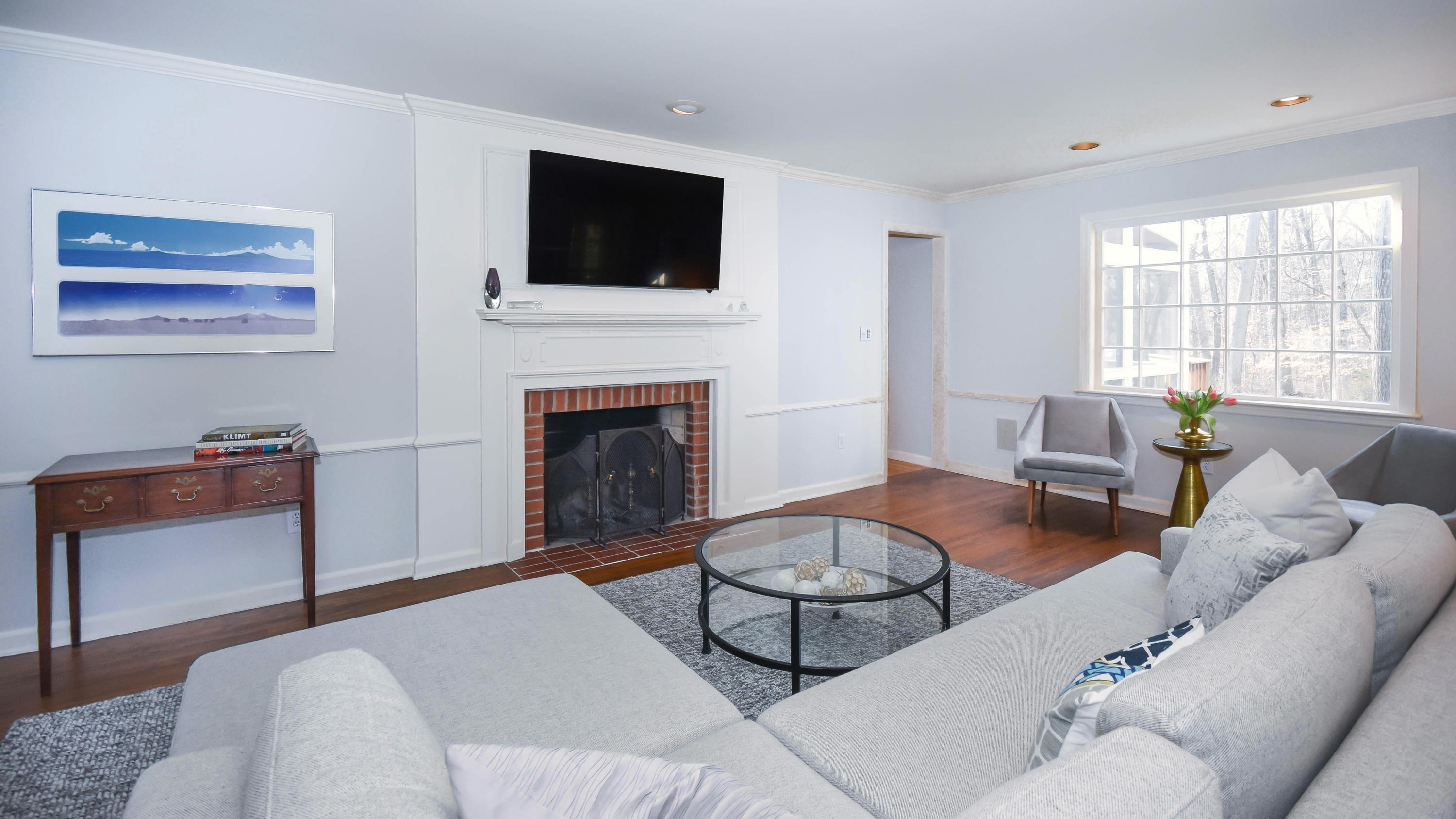 45 Silver Ridge Road New Canaan, CT 06840 - Photo 4 of 24 a living room with furniture a flat screen tv and a fireplace