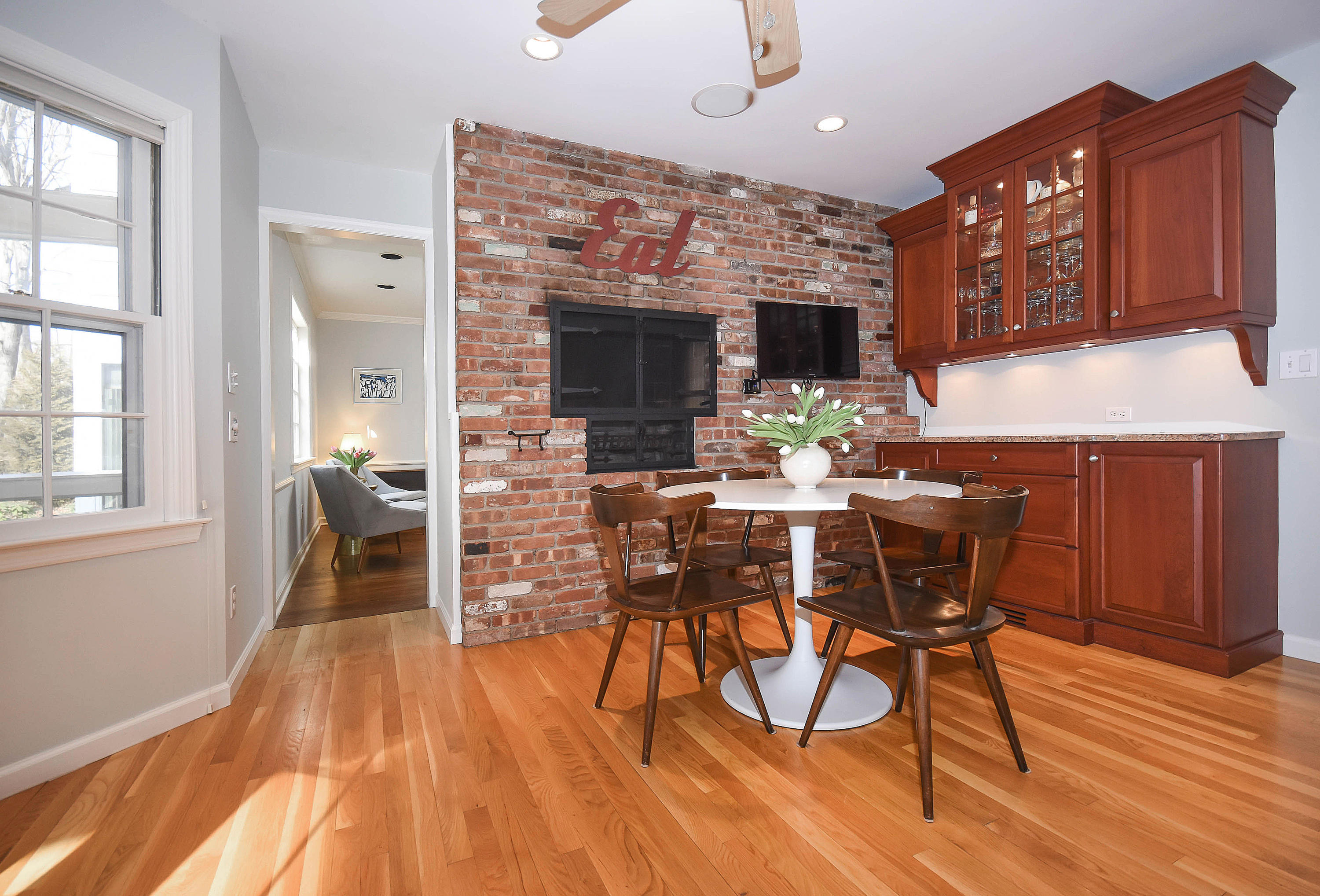 45 Silver Ridge Road New Canaan, CT 06840 - Photo 7 of 24 a view of a dining room with furniture and wooden floor