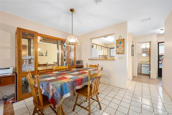 a dining room filled with furniture and window