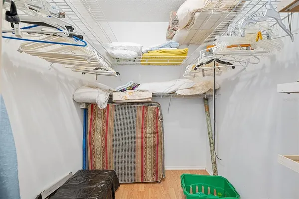 a bedroom with a bed and a hallway