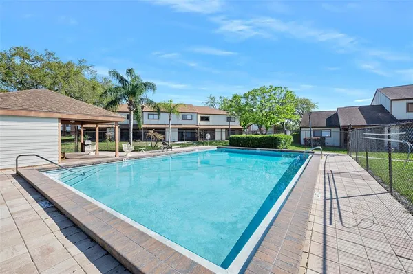 a view of swimming pool with a yard