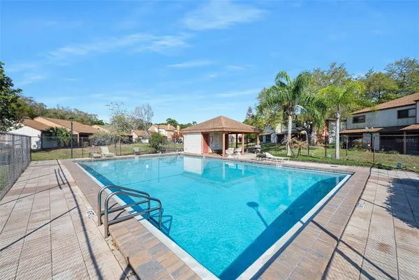 a view of a swimming pool with a patio