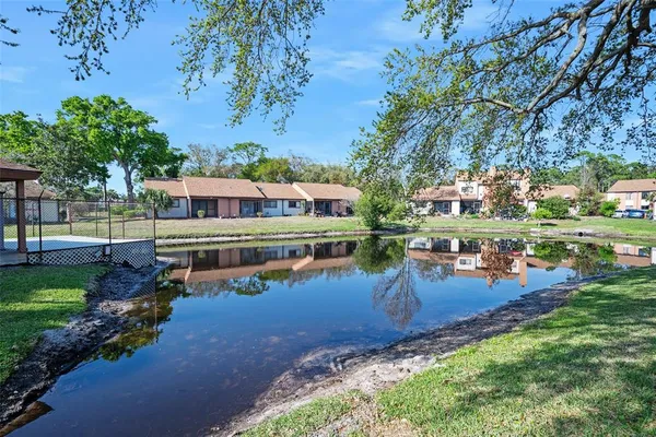 an aerial view of a house with swimming pool patio and outdoor seating