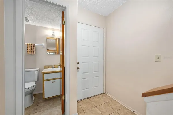 a bathroom with a toilet sink and shower