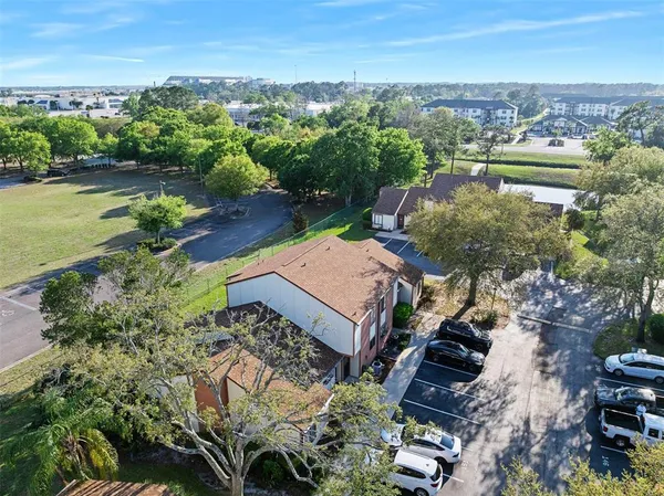 an aerial view of a house with a lake view