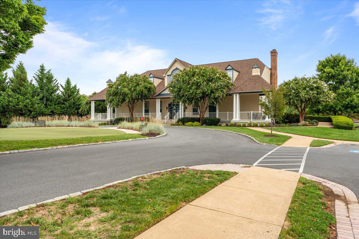 2442 Rippling Brook Road Frederick, MD 21701 - Photo 73 of 85 a front view of a house with a yard and trees