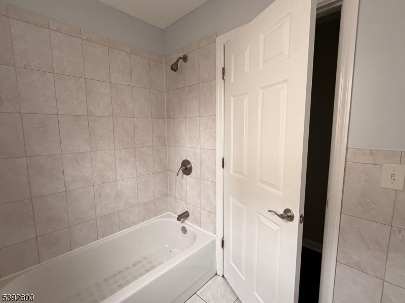 139 Inslee Place, Unit 1 Elizabeth Port, NJ 07206 - Photo 15 of 18 a bathroom with a bathtub