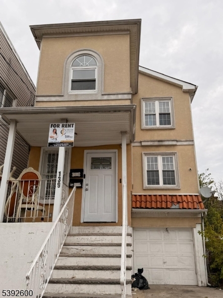 139 Inslee Place, Unit 1 Elizabeth Port, NJ 07206 - Photo 18 of 18 a view of a building with car parked