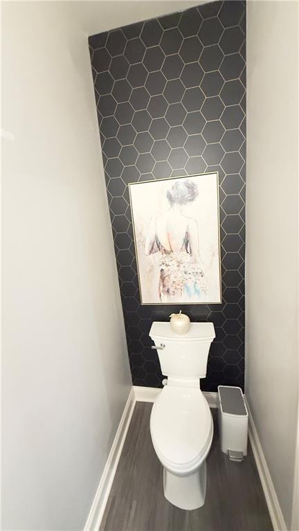 3370 Elkhorn Ridge Run Dacula, GA 30019 - Photo 25 of 29 a white toilet sitting next to a white wall