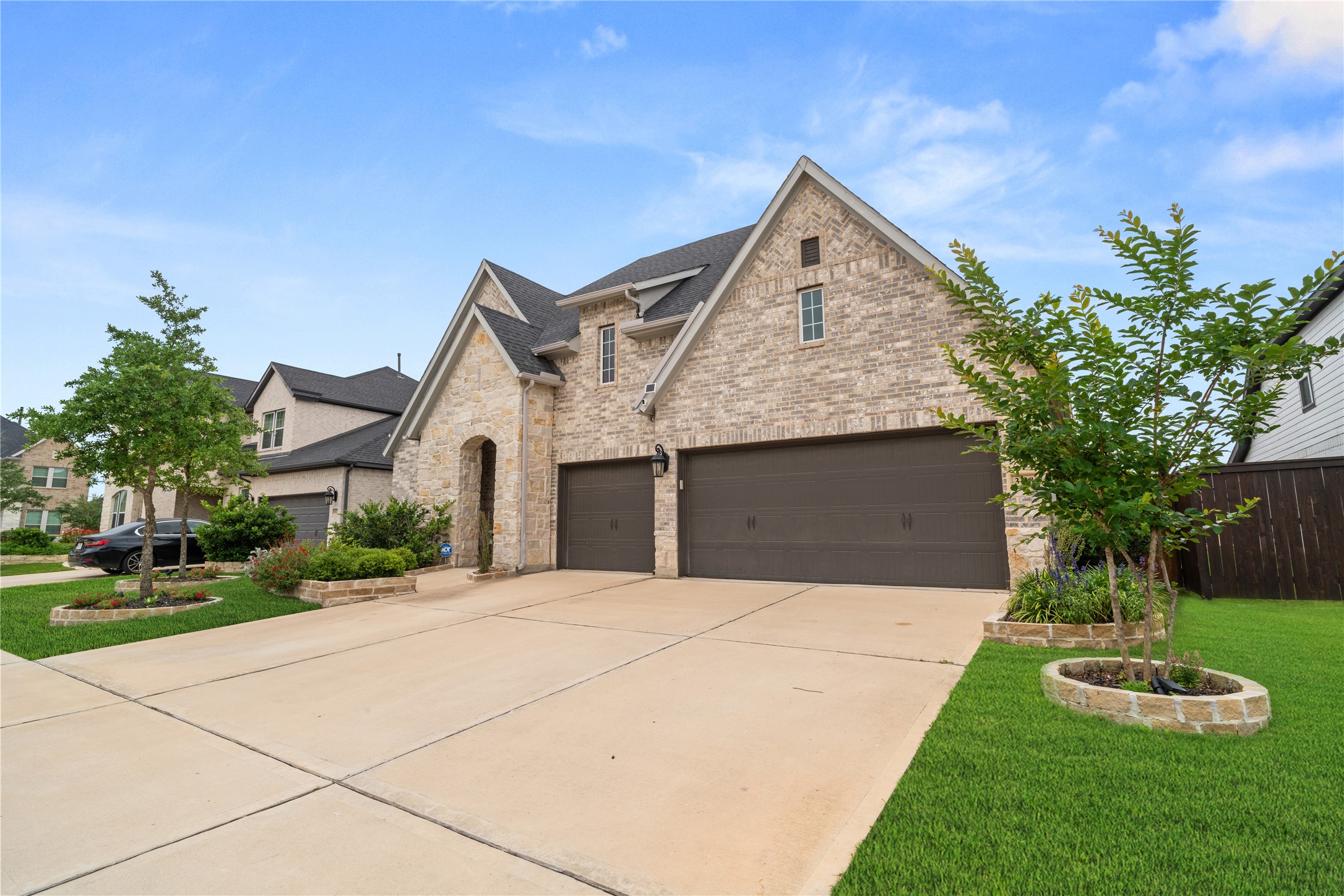 3118 Swift Way Katy, TX 77493 - Photo 2 of 34 Front Exterior (Angle View) – Curb appeal enhanced by a combination of stone accents, well-kept lawn, and inviting entryway.