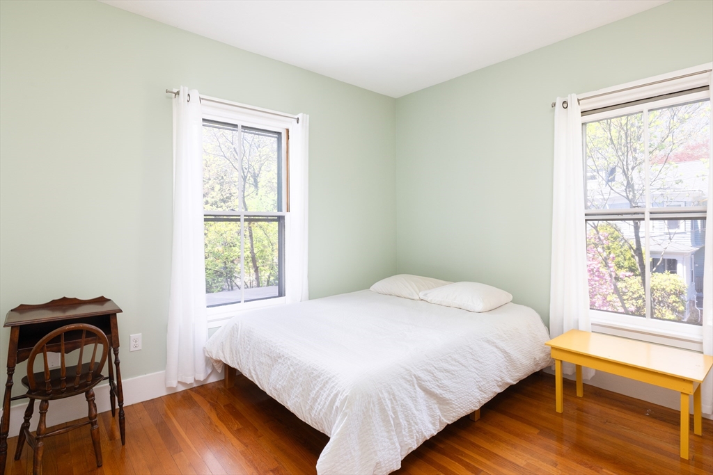 135 Langley Road, Unit 135 Newton, MA 02459 - Photo 13 of 20 a bedroom with a bed and a window