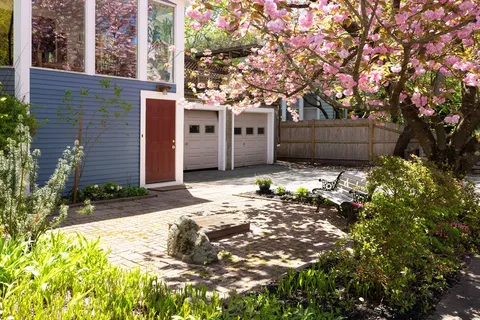 a view of a house with a tree in the background