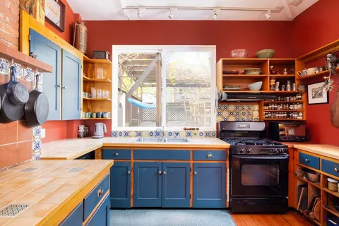 a kitchen with a stove and a sink