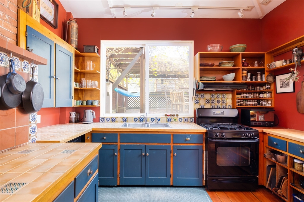135 Langley Road, Unit 135 Newton, MA 02459 - Photo 6 of 20 a kitchen with a stove and a sink