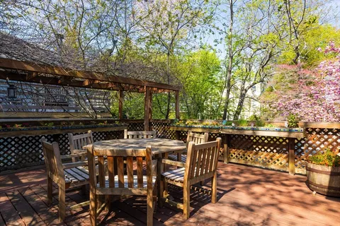 a view of an outdoor space with a table and chairs