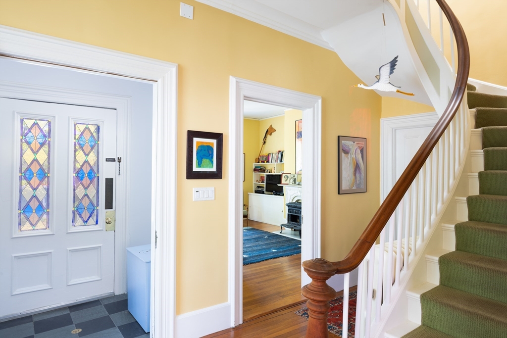 135 Langley Road, Unit 135 Newton, MA 02459 - Photo 10 of 20 a view of a hallway with wooden floor and entryway
