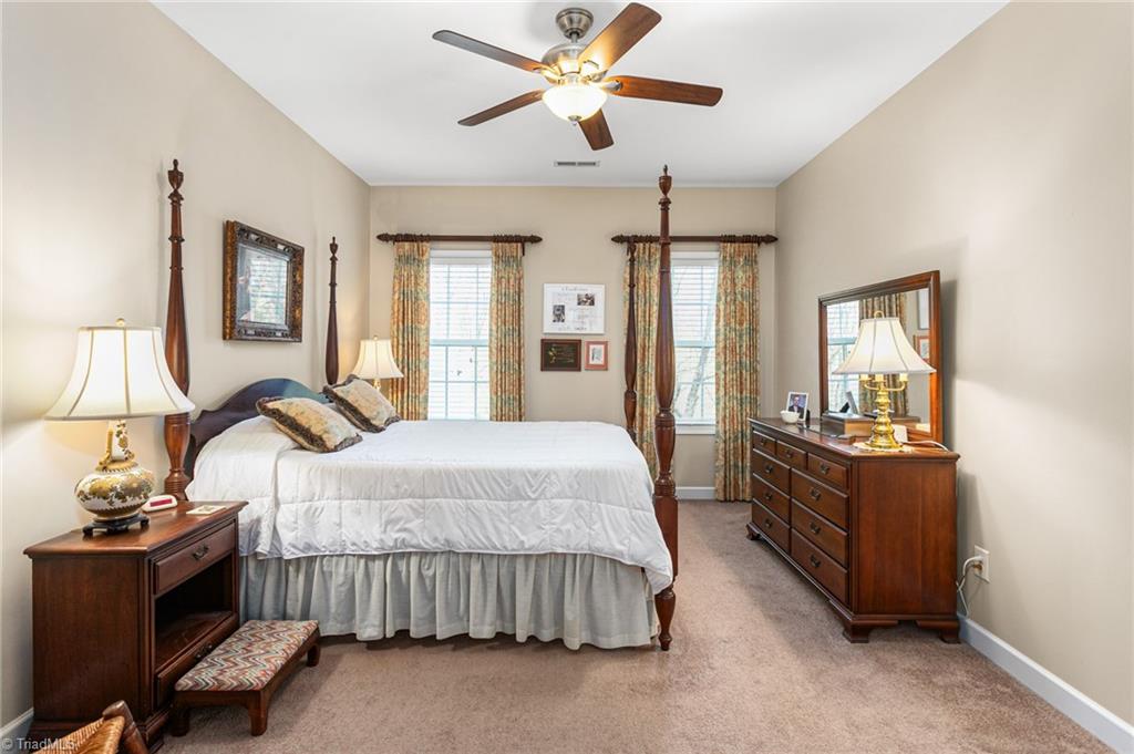 2141 Longshadow Drive Graham, NC 27253 - Photo 14 of 41 Primary bedroom has views of the trees behind the property