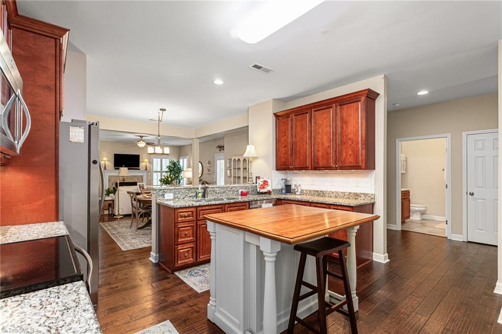 2141 Longshadow Drive Graham, NC 27253 - Photo 8 of 41 Kitchen is open to the dining and living room