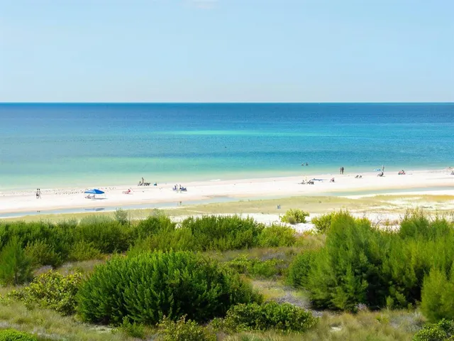 a view of a house with outdoor space and sitting area