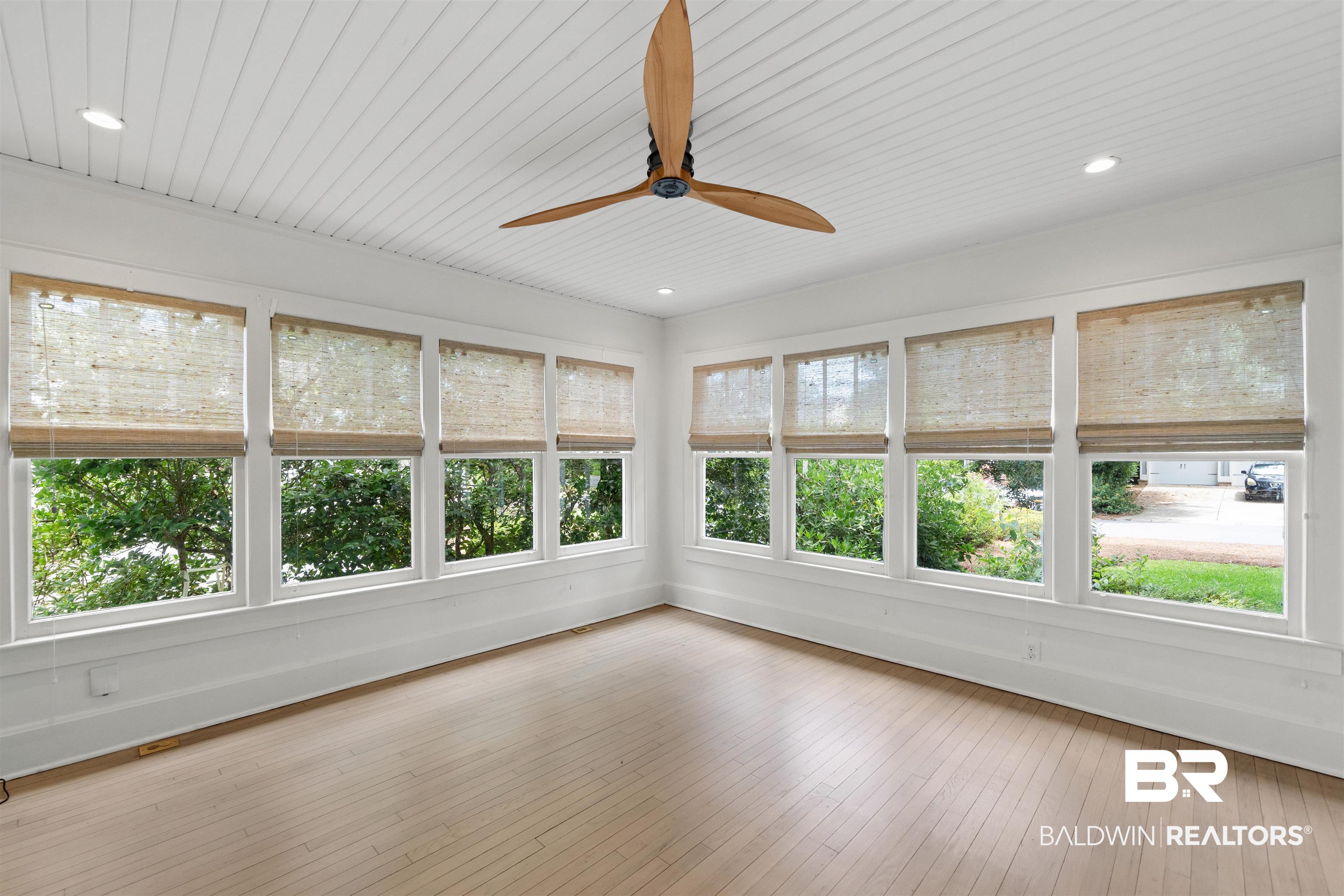 106 White Avenue Fairhope, AL 36532 - Photo 8 of 35 Unfurnished sunroom featuring healthy amount of natural light, hardwood / wood-style flooring, recessed lighting, and wood ceiling