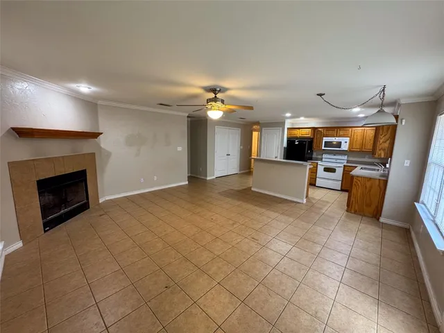 a view of a kitchen with furniture and a fireplace