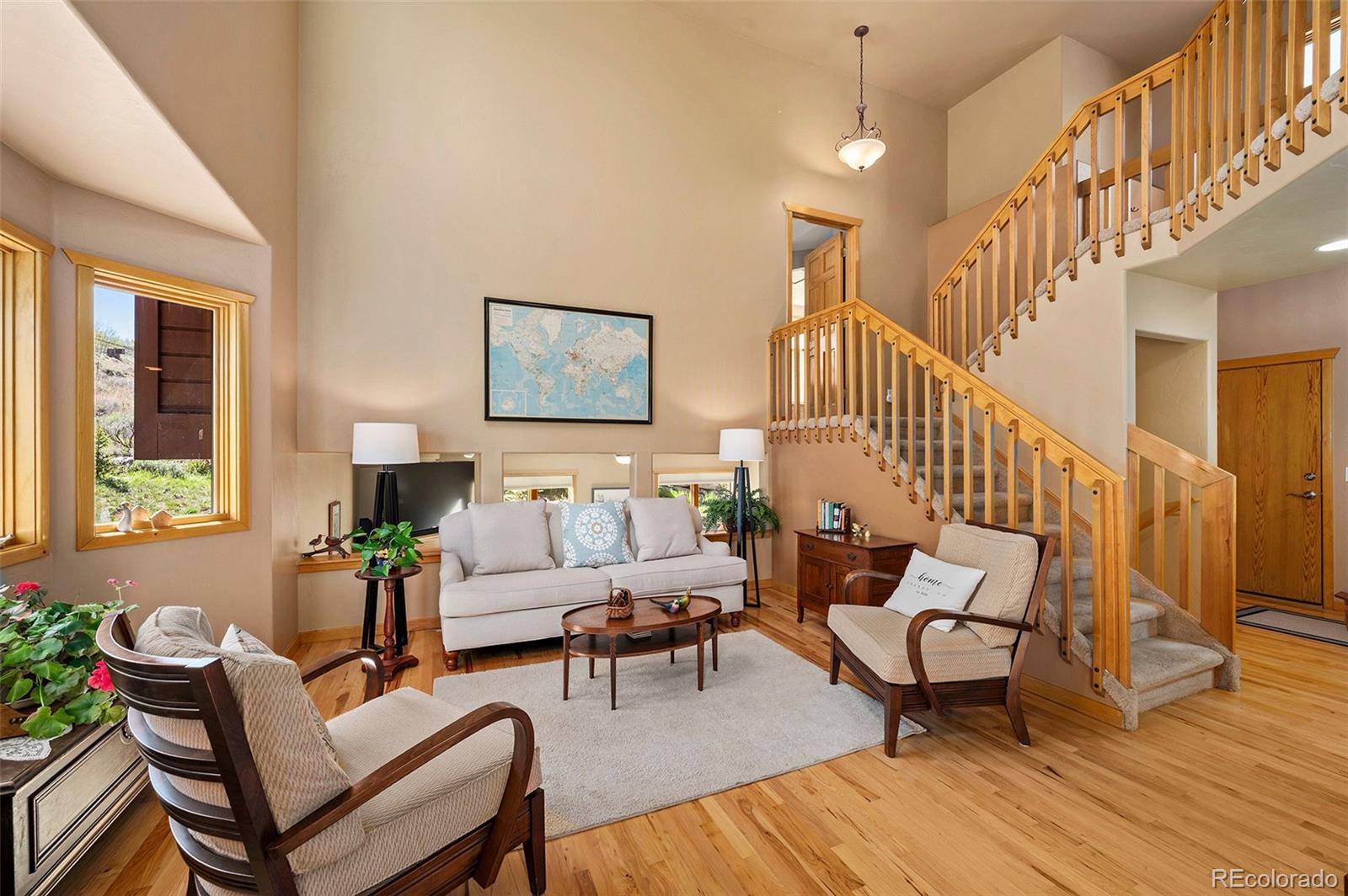 290 Village Road Granby, CO 80446 - Photo 8 of 45 a living room with furniture and a wooden floor